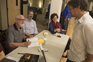 Bible faculty members Marion Bontrager, John Sharp and Michele Hershberger sign "The Bible as Story," their new book.