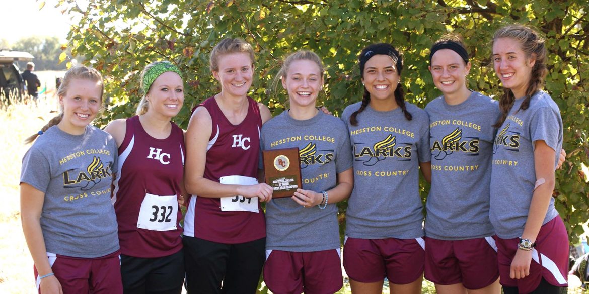 HC women's cross country team poses with the first place plaque at the Bethel Invitational meet