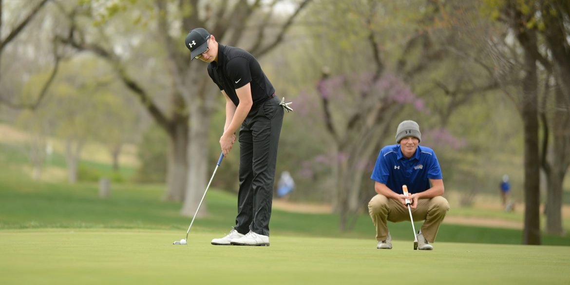Chandler Roberts putts for Hesston College golf