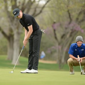 Chandler Roberts putts for Hesston College golf