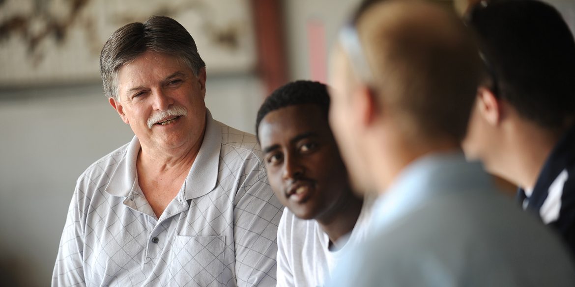 Dan Miller talks with aviation students in a photo from 2013.