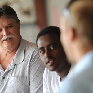 Dan Miller talks with aviation students in a photo from 2013.