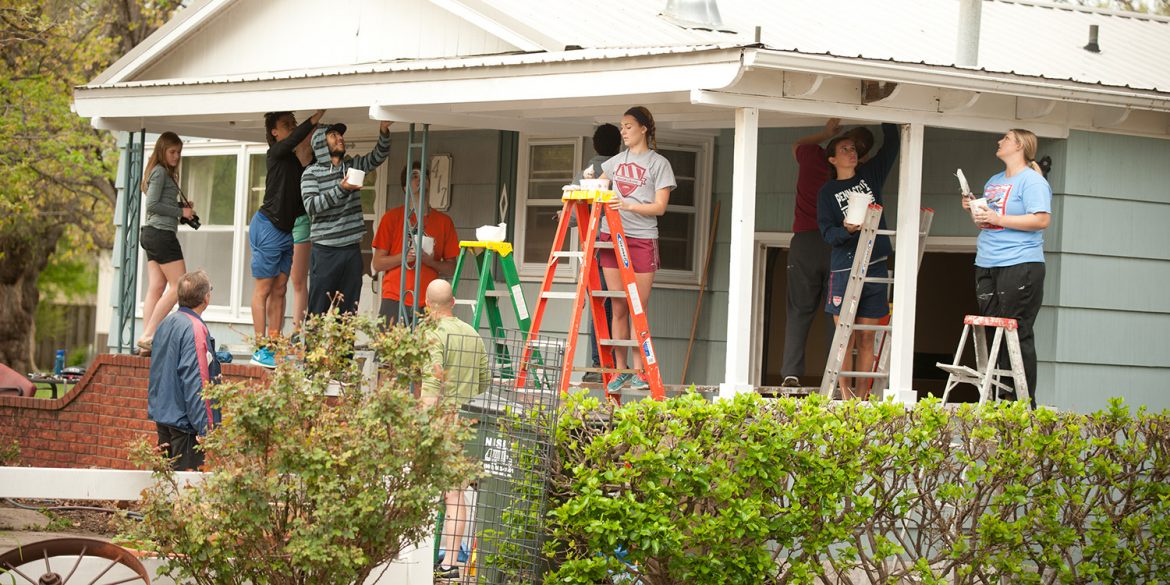 Hesston College students serve in the Hesston community during Larkfest