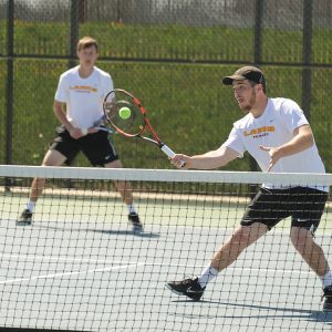 Hesston College men's tennis action photo