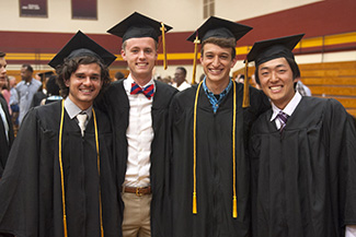 Four graduates at Hesston College Commencement 2016