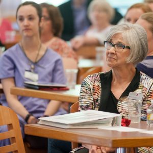 Bonnie Sowers listens to tributes at a reception in her honor.