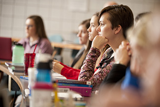 Nursing students listen in class