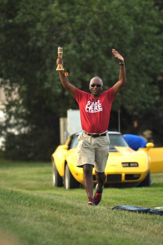 President Dr. Joseph Manickam runs the “official Mod Olympics torch” on its final leg to declare the opening of the 108th Mod Olympics. 