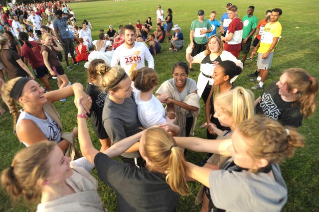 A mod works to untangle themselves during the “Human Knot” game at Mod Olympics, the final kick-off event of Opening Weekend prior to the start of classes. Each mod’s uniquely themed style of dress and the nonsensical games allow students to have fun and get to know one another in a laid back setting. 