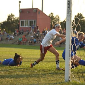 Hesston College women's soccer player Kenzie Johnson scores in a September 9, 2017 match with Pratt Community College.