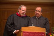 Hesston College Board of Directors Chair Kelvin Friesen and Mennonite Education Agency Executive Director Carlos Romero speak at the inauguration service.