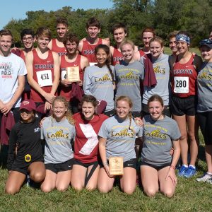 Hesston College men's and women's cross country teams display their team champions plaques after the Bethel Invitational meet, Oct. 7, 2017