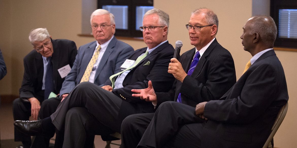 Former Hesston College presidents Laban Peachey, Kirk Alliman and Howard Keim visit with new president Joe Manickam