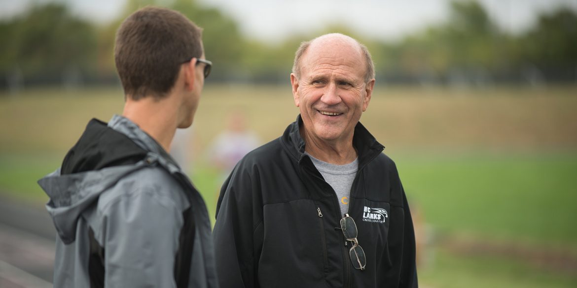 Coach Gerry Sieber visits with assistant coach Todd Lehman at cross country practice