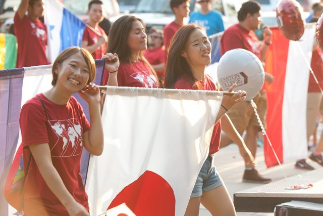 Japanese students Rio Mori ’19 and Risa Fukaya ’19 represent their countries and Hesston College along with other international students in the community Homecoming parade in September.