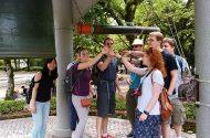 Participants on the Japan trip ring the Hiroshima Peace Bell.