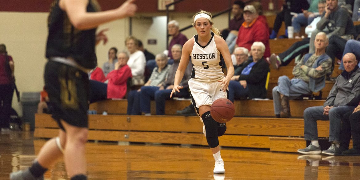 Hunger Begley brings the ball up the court for Hesston College women's basketball.