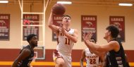 Hesston College men's basketball action photo - Cal Hartley
