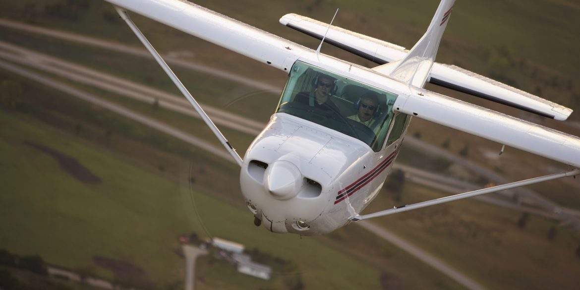 Hesston College plane in flight