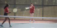 Hesston College women's tennis action photo