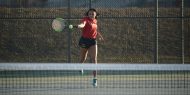 Hesston College women's tennis action photo