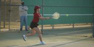 Hesston College women's tennis action photo