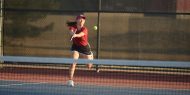 Hesston College women's tennis action photo
