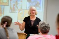 Louise Matthews from Bluffton University's Lion and Lamb Peace Center speaks to a Monday evening crowd