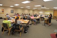 Louise Matthews from Bluffton University's Lion and Lamb Peace Center speaks to a Monday evening crowd