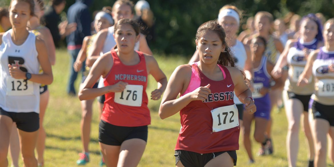 Hesston College women's cross country action photo - Sam Trejo
