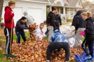 Student athletes raking leaves