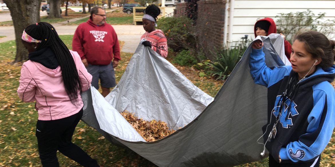 Members of the women’s soccer team move a load of leaves during a Saturday Athletic Department service project where all student-athletes and coaches raked leaves in the community. Photo by Jaden Hostetter ’19.