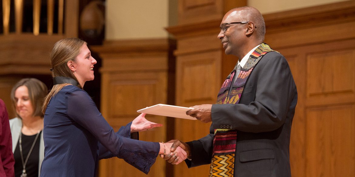 Robin (Morris) Slabach receives her BSN degree from President Joseph A. Manickam during a Dec. 13, 2018, RN to BSN pinning ceremony and graduation.