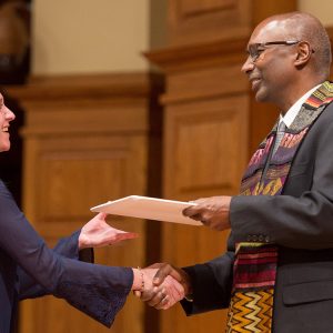 Robin (Morris) Slabach receives her BSN degree from President Joseph A. Manickam during a Dec. 13, 2018, RN to BSN pinning ceremony and graduation.