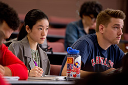 Risa Fukaya takes notes in Bib Lit class.