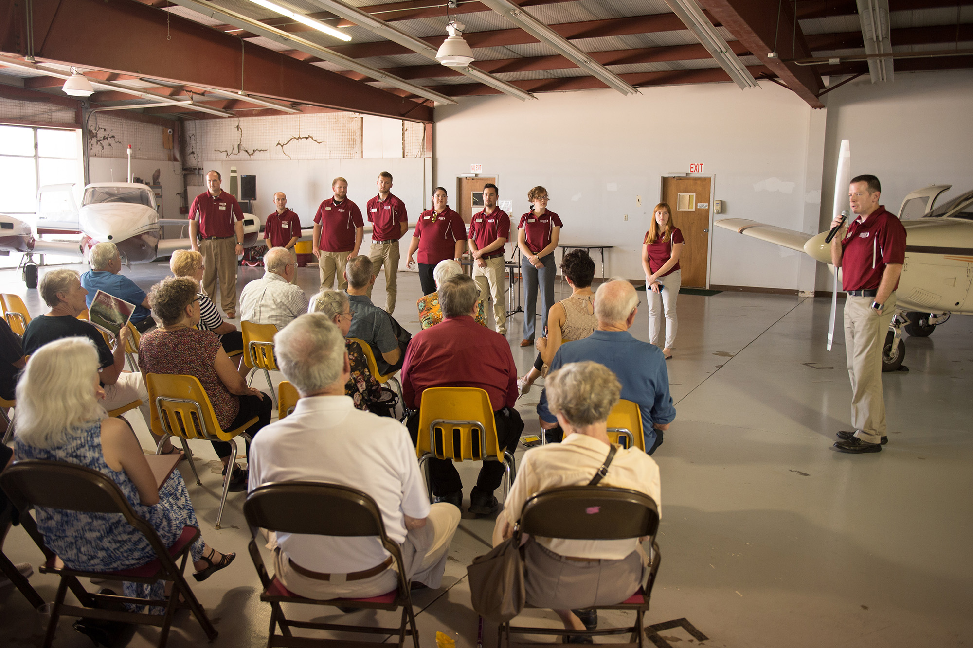 Aviation director Mike Baker introduces the aviation faculty and staff at an open house Friday afternoon.