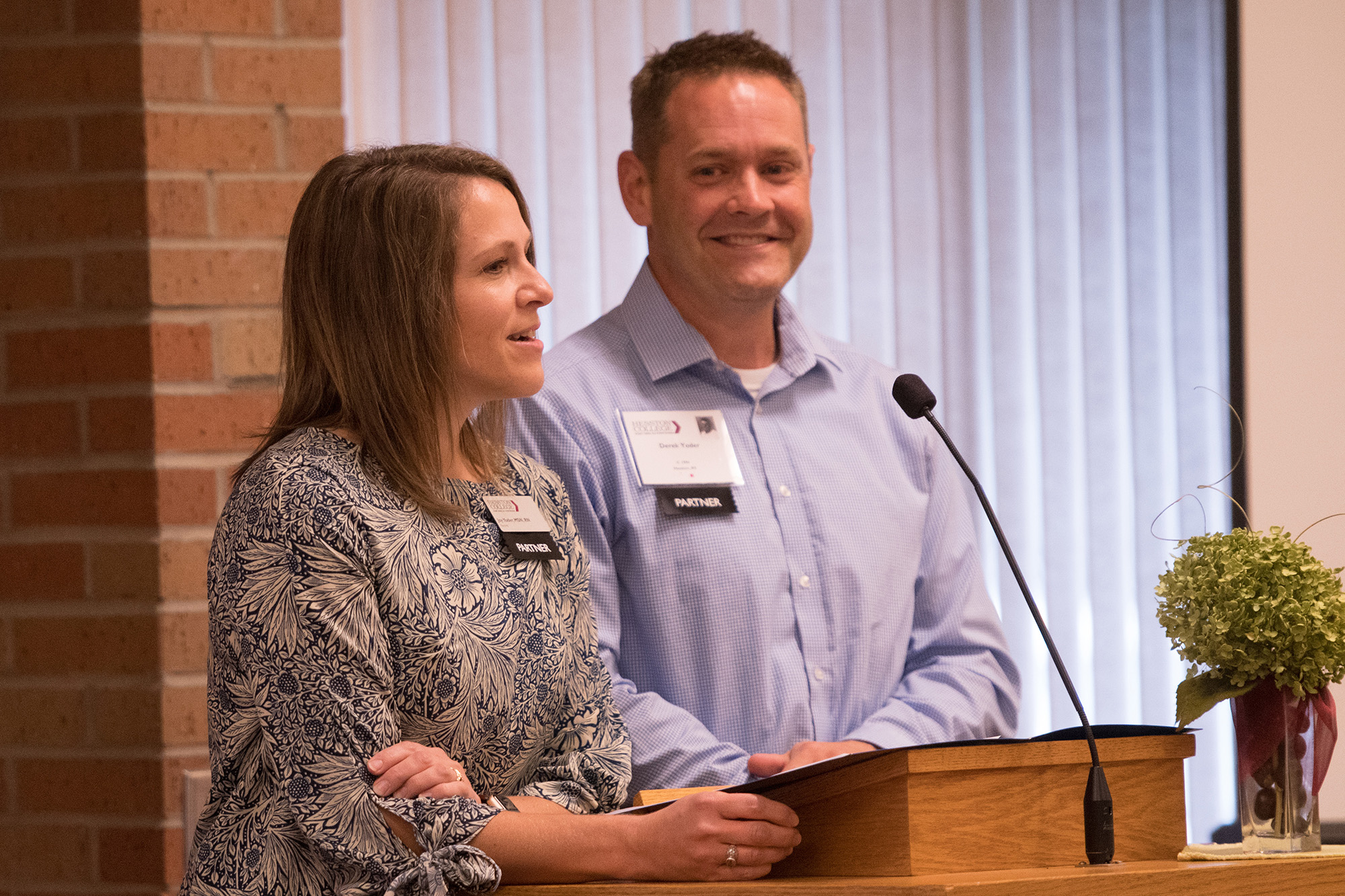 Nursing prof Joy (Smith) '96 and former staff Derek '96 Yoder speak at the annual Partner Luncheon.