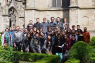 Europe tour group photo by a church