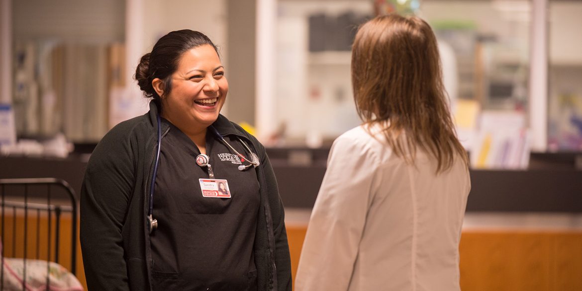 A student meets with faculty member Joy Yoder during clinical rotations.
