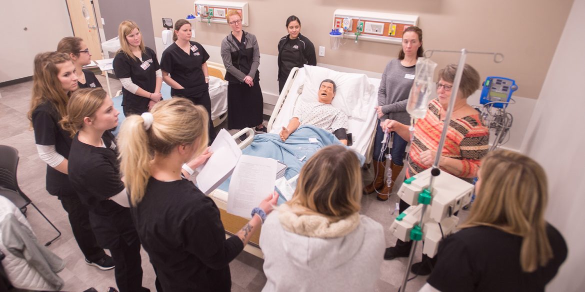 Students and faculty in the nursing skills lab