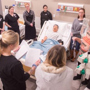 Students and faculty in the nursing skills lab