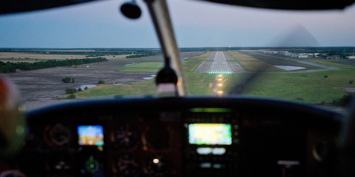 landing a plane at dusk, Newton City-County Airport