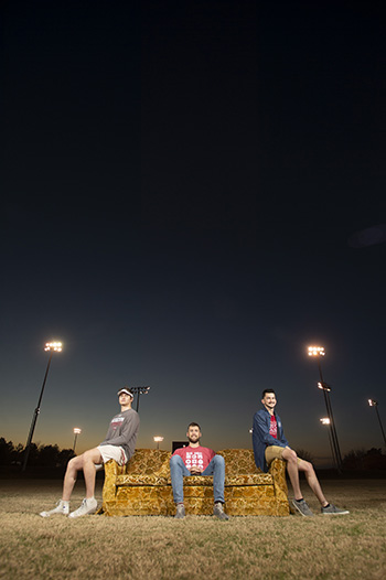 Jacob Mullins ’22, Chris Lichti ’21, and Ethan Klassen ’21 enjoy an autumn sunset on Goldy from the center of Sieber Field.