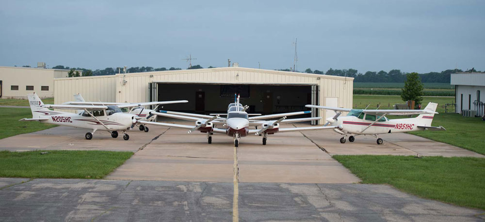Hesston College Aviation fleet on display outside of a hangar