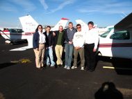 Hesston College Aviation students and instructors stading in front of a plane