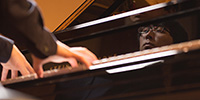 Keyboard Studies - a student performs on the college's concert Steinway