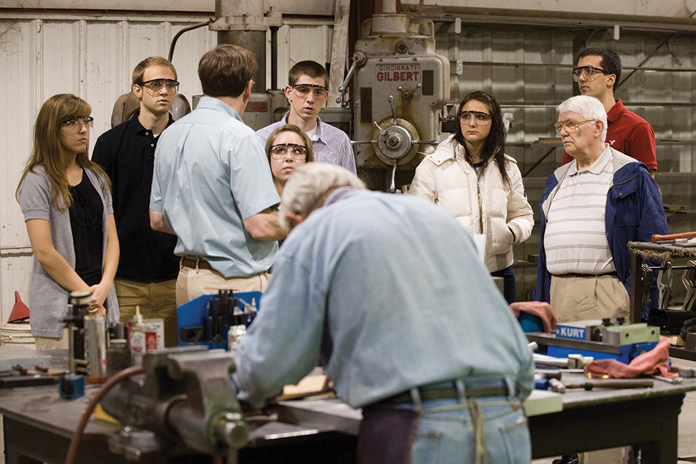 Former professor of business Bill Mason takes a class to visit Harper Industries in Harper, Kan.