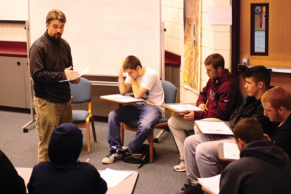 Former Hesston College business instructor David Levan provides instruction to students.