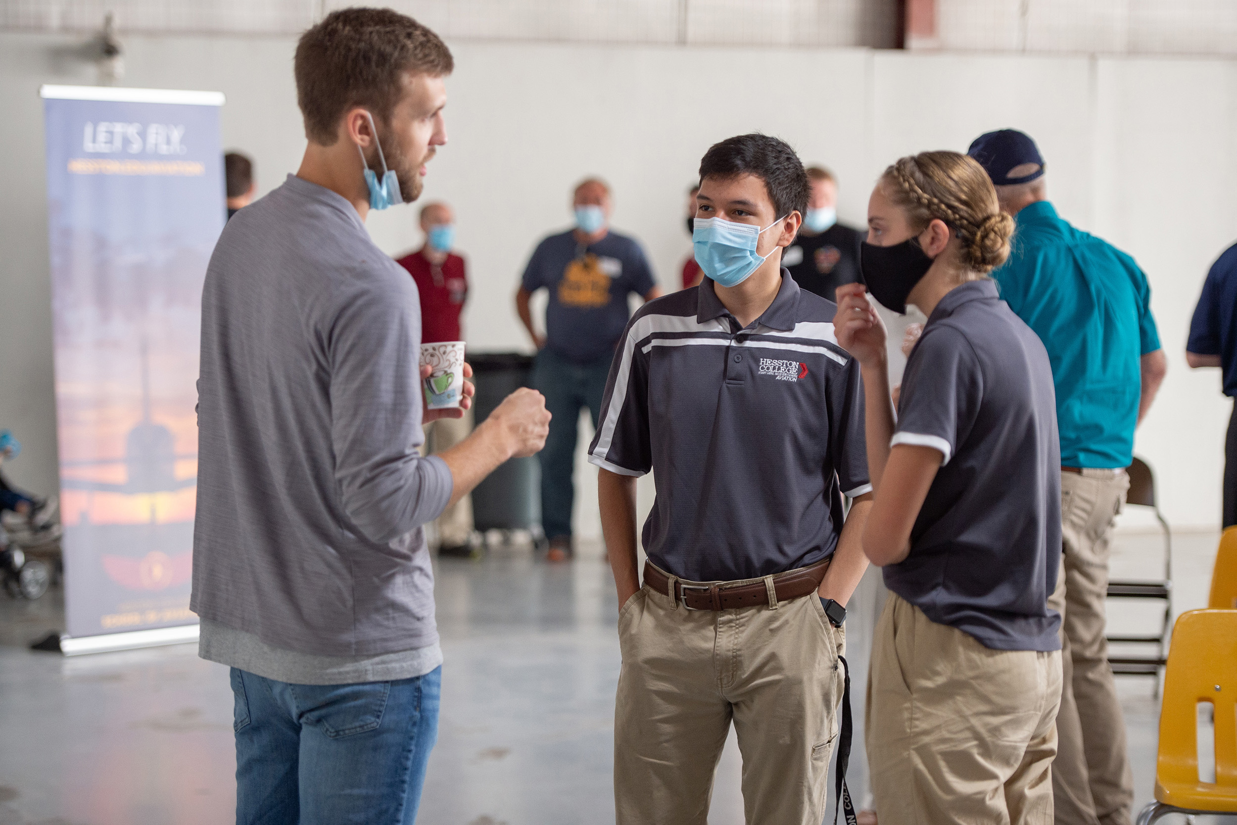 Hesston College Homecoming 2021 - Aviation Hangar - graduate Chris Lichti and current students