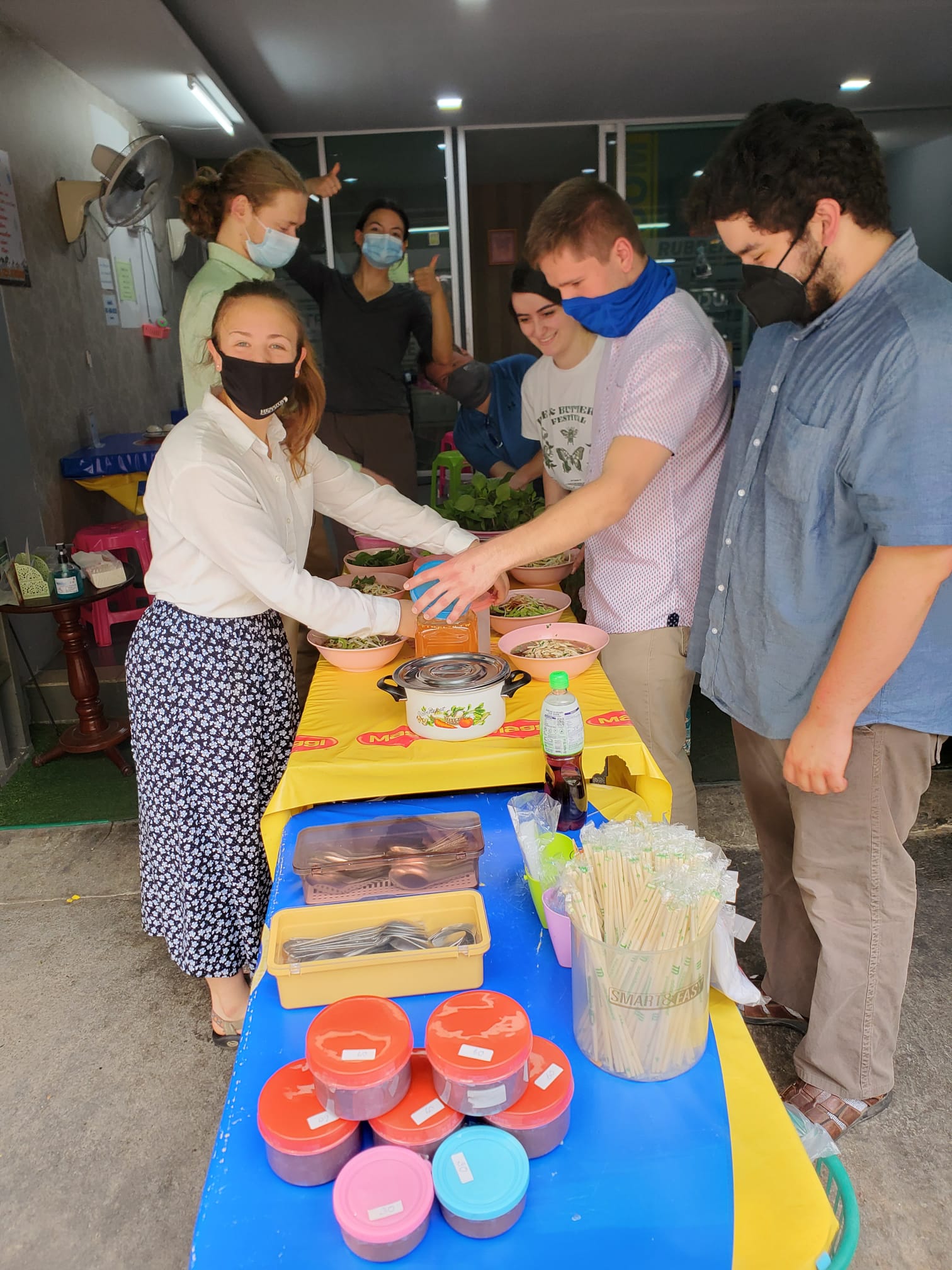 Adding condiments to noodle bowls